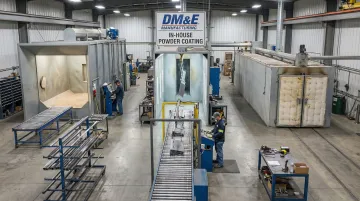 DM&amp;E in-house powder coating facility with blasting booth and curing oven