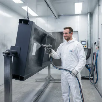 Professional industrial powder coating and paint application on fabricated metal components in an industrial facility