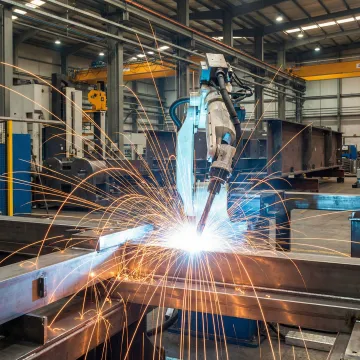 CNC welding and metal fabrication in an industrial manufacturing facility