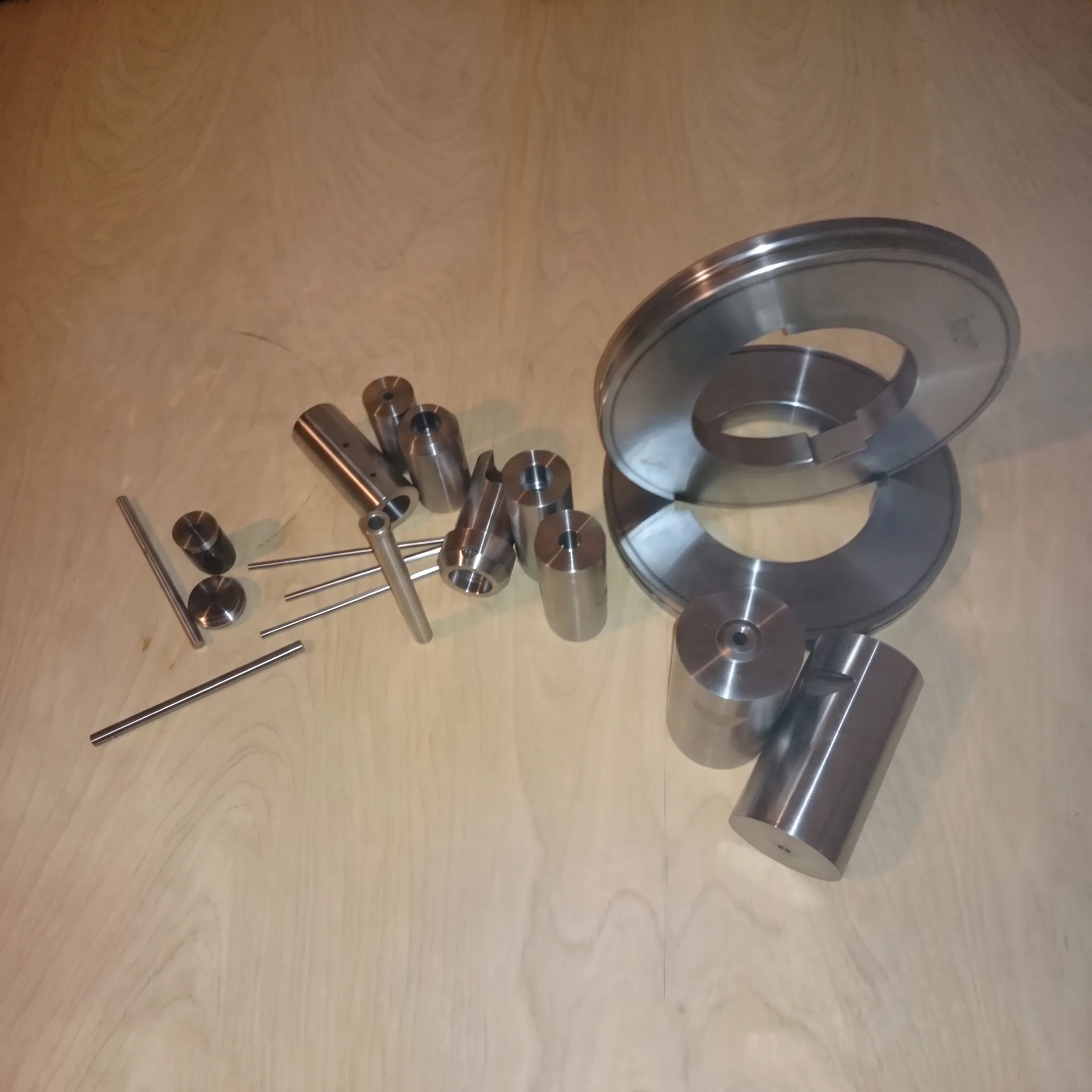 Custom stamped metal parts and tooling arranged for inspection