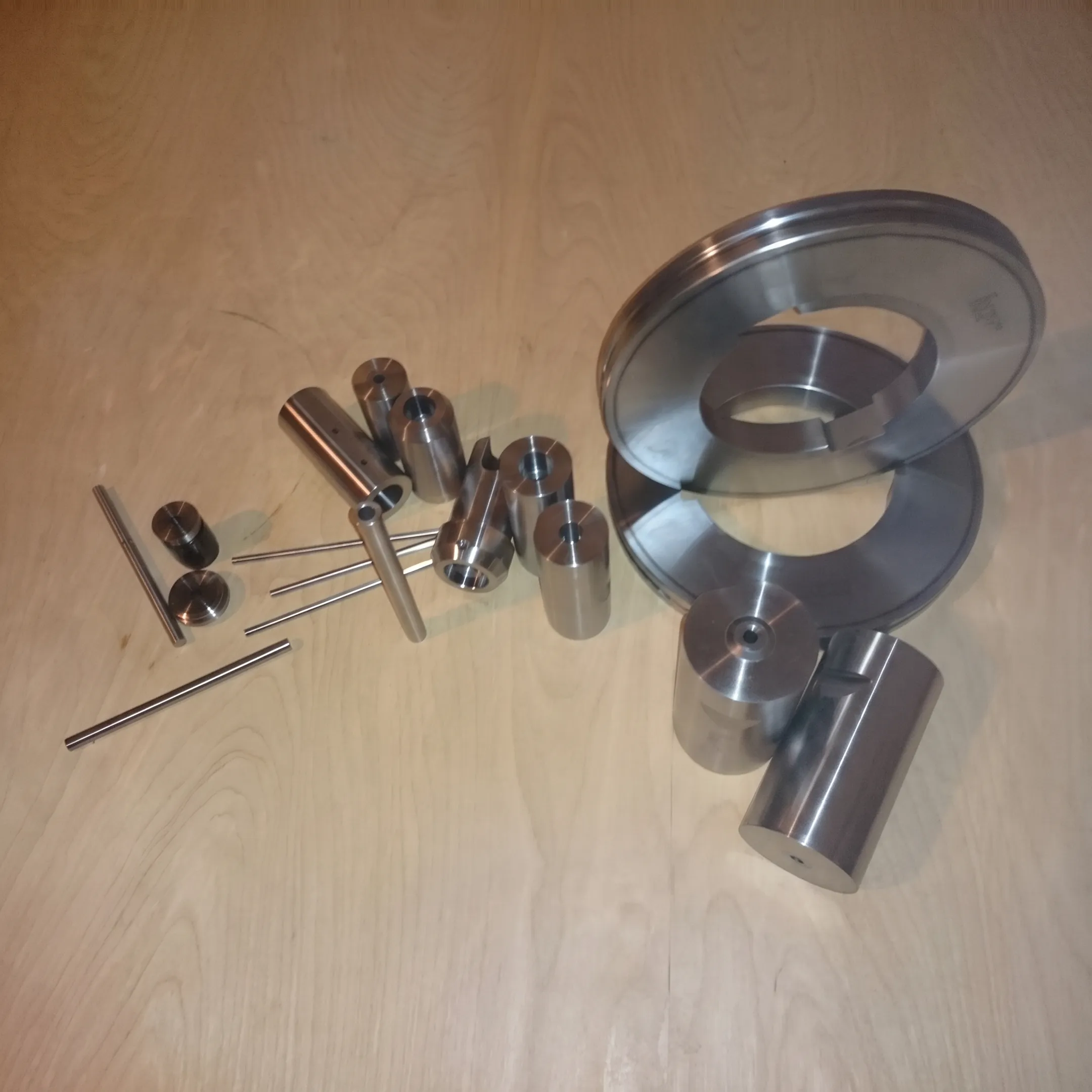 Finished metal tooling and machined components arranged for inspection