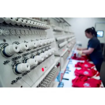Embroidery machine technician testing stitches after repair