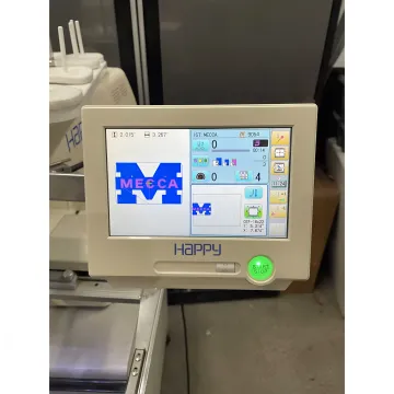 Embroidery machine repair technician inspecting electronics