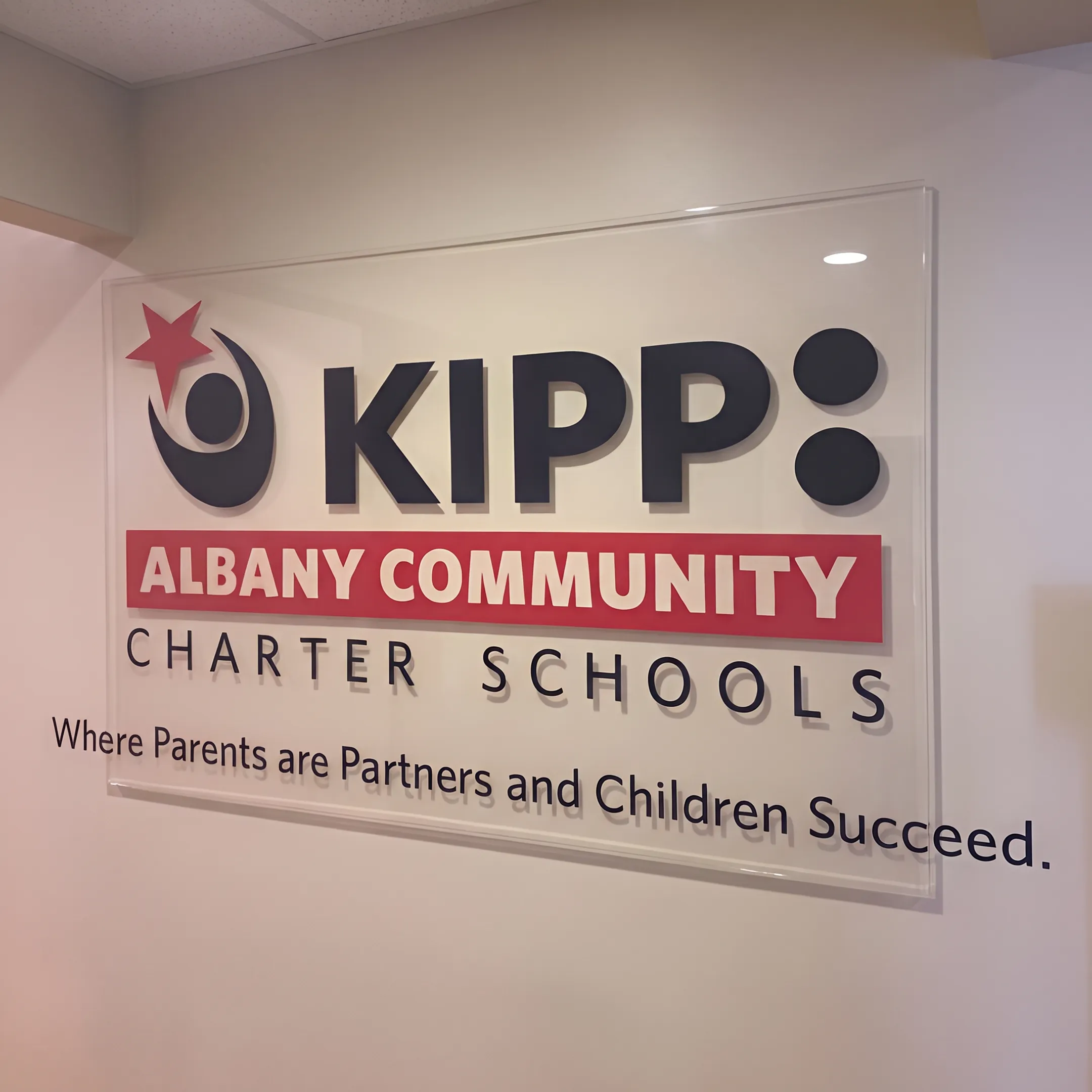 Custom acrylic sign displayed in a branded business interior