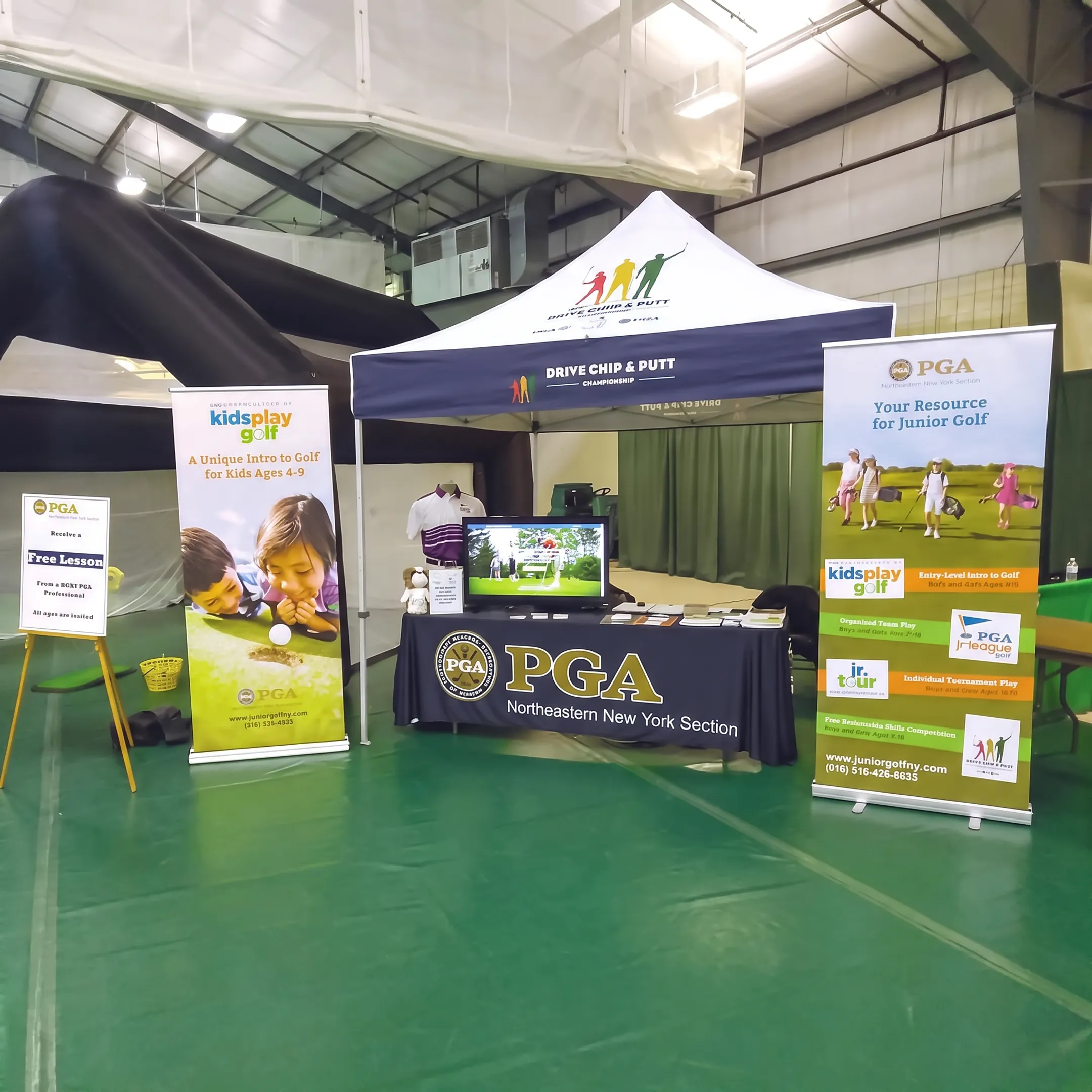 Trade show exhibit with branded graphics, signage, and printed display materials