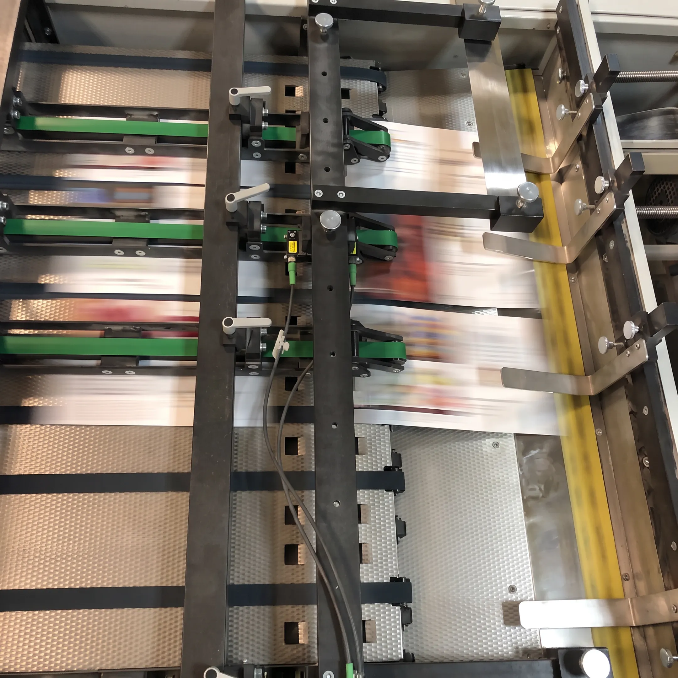 Printed brochures and mailers being finished in a commercial print facility