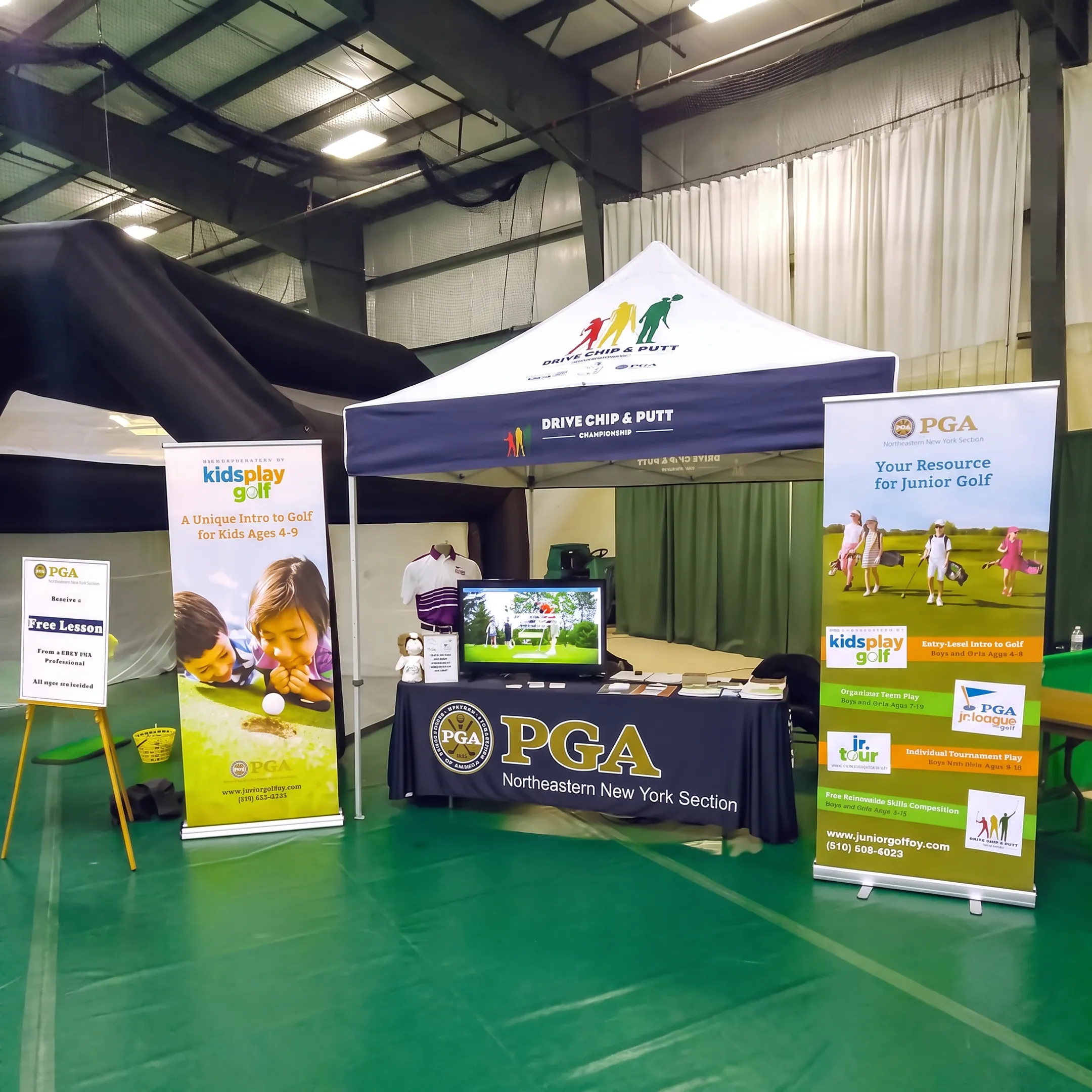 Production team preparing branded exhibit graphics