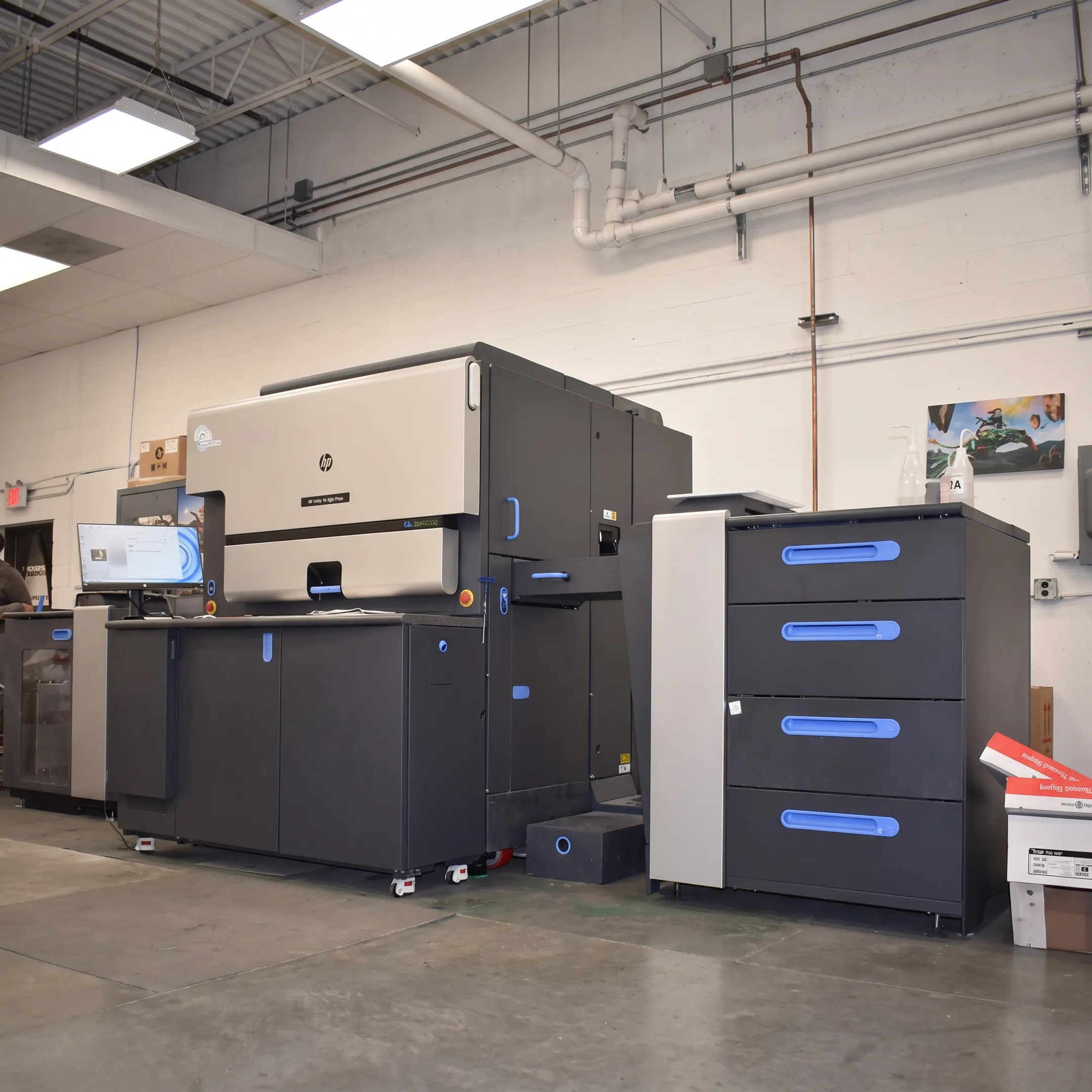 Digital printing team producing colorful business materials on a commercial press