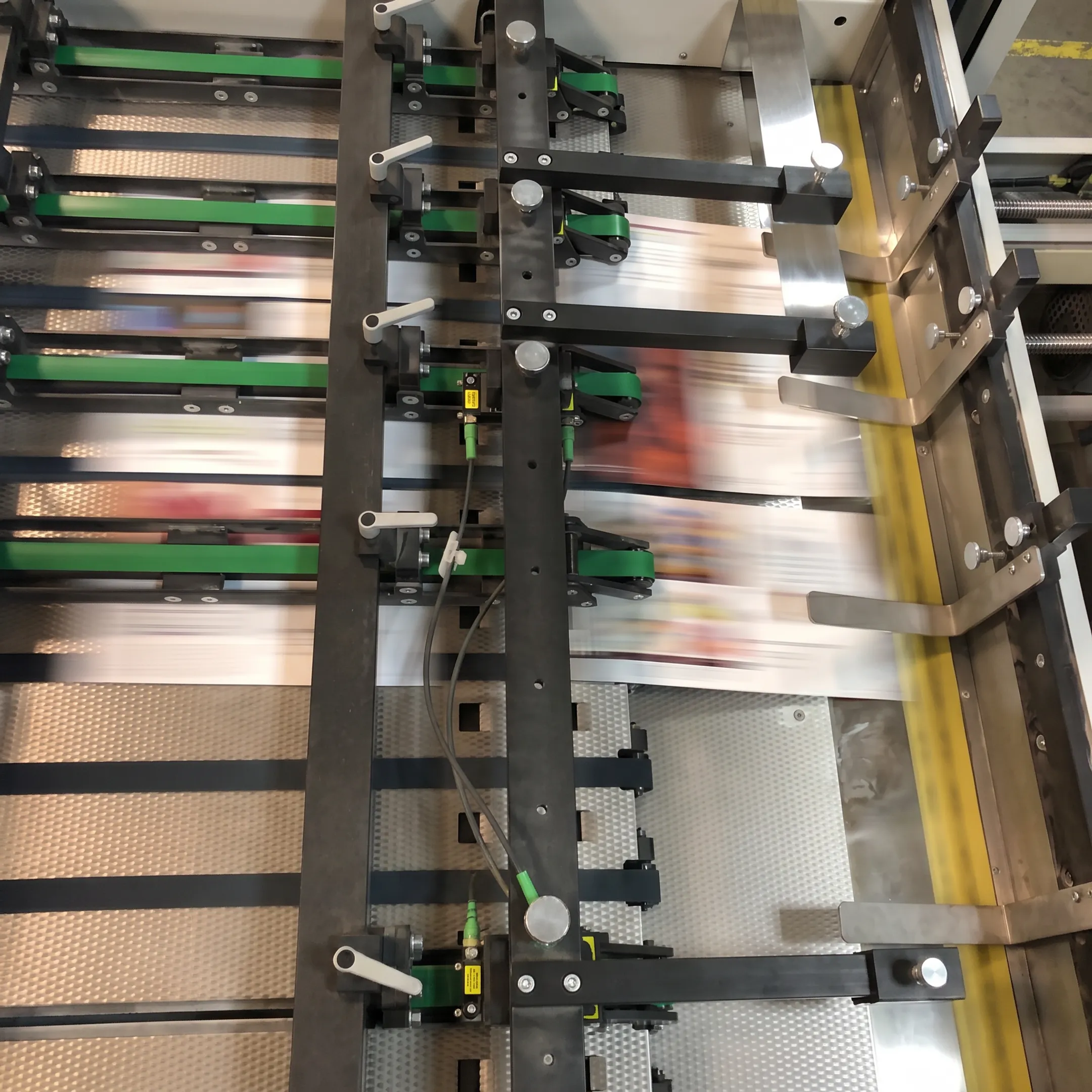 Printed marketing materials moving through commercial production