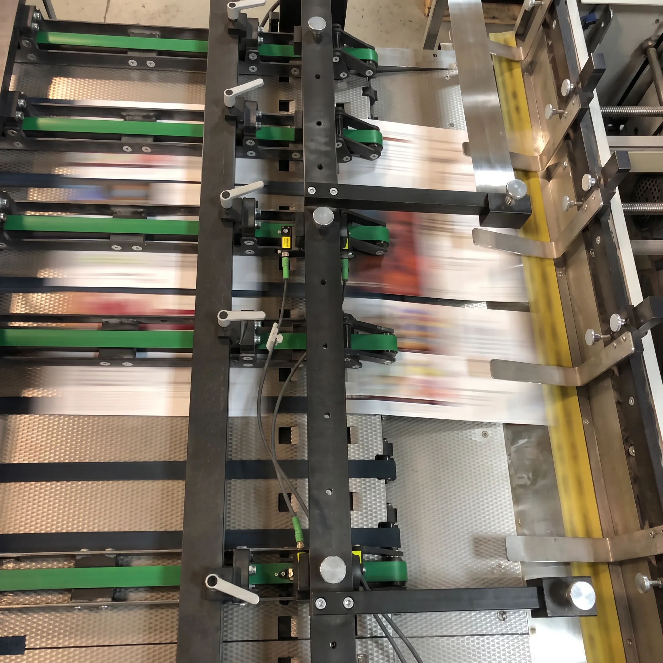 Personalized direct mail pieces moving through print and mailing production