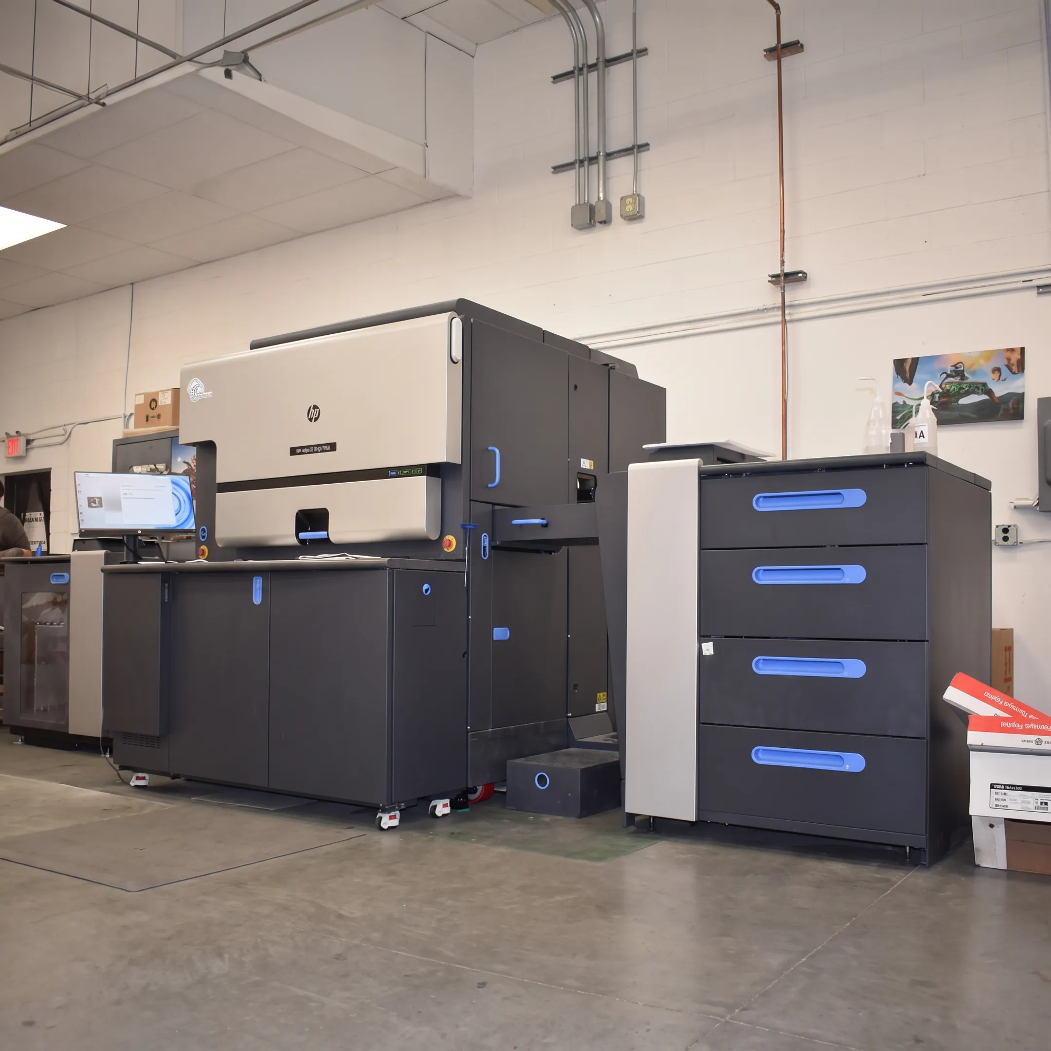 Digital printing team producing colorful branded materials in a professional print facility