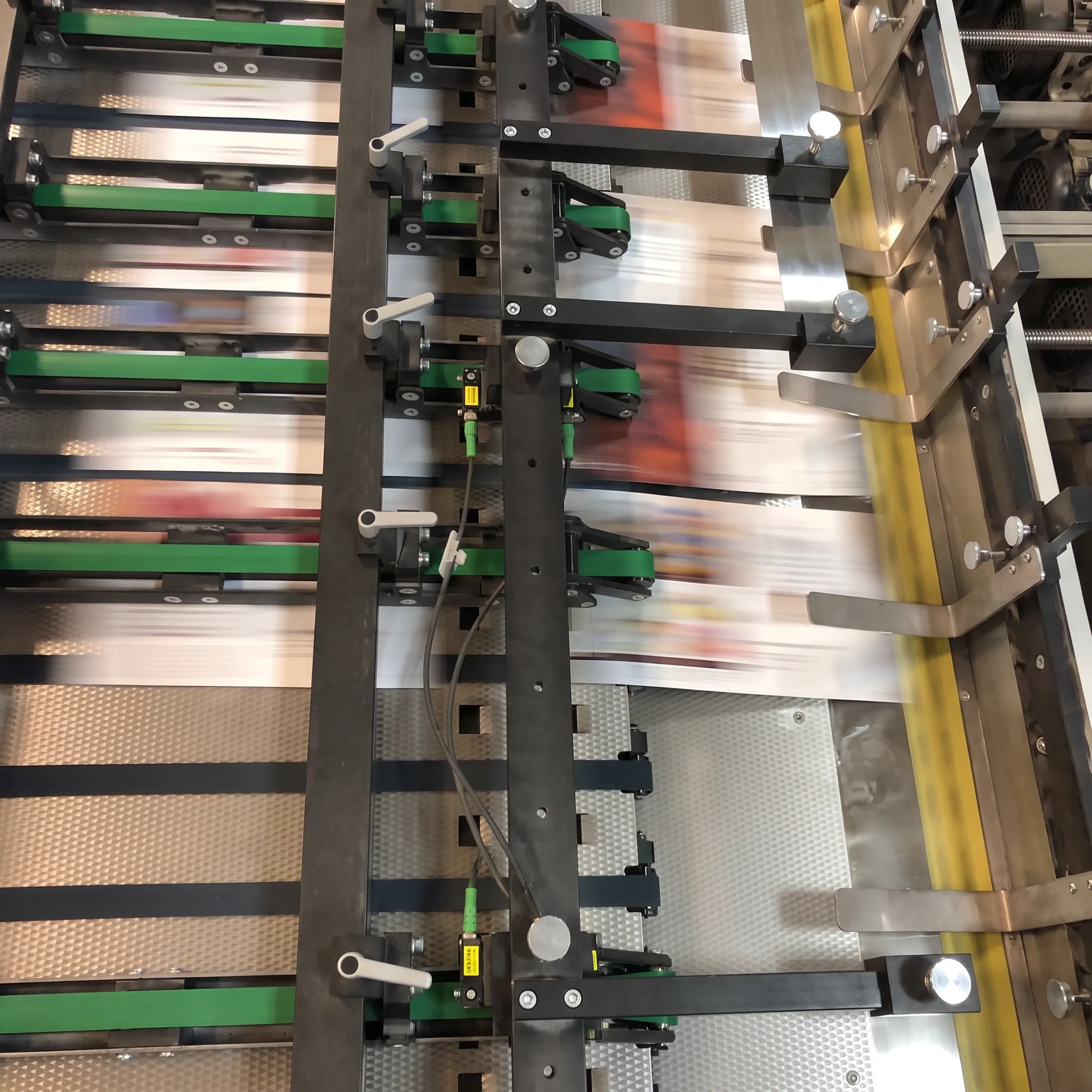Printed brochures and marketing materials being finished in an Albany production facility