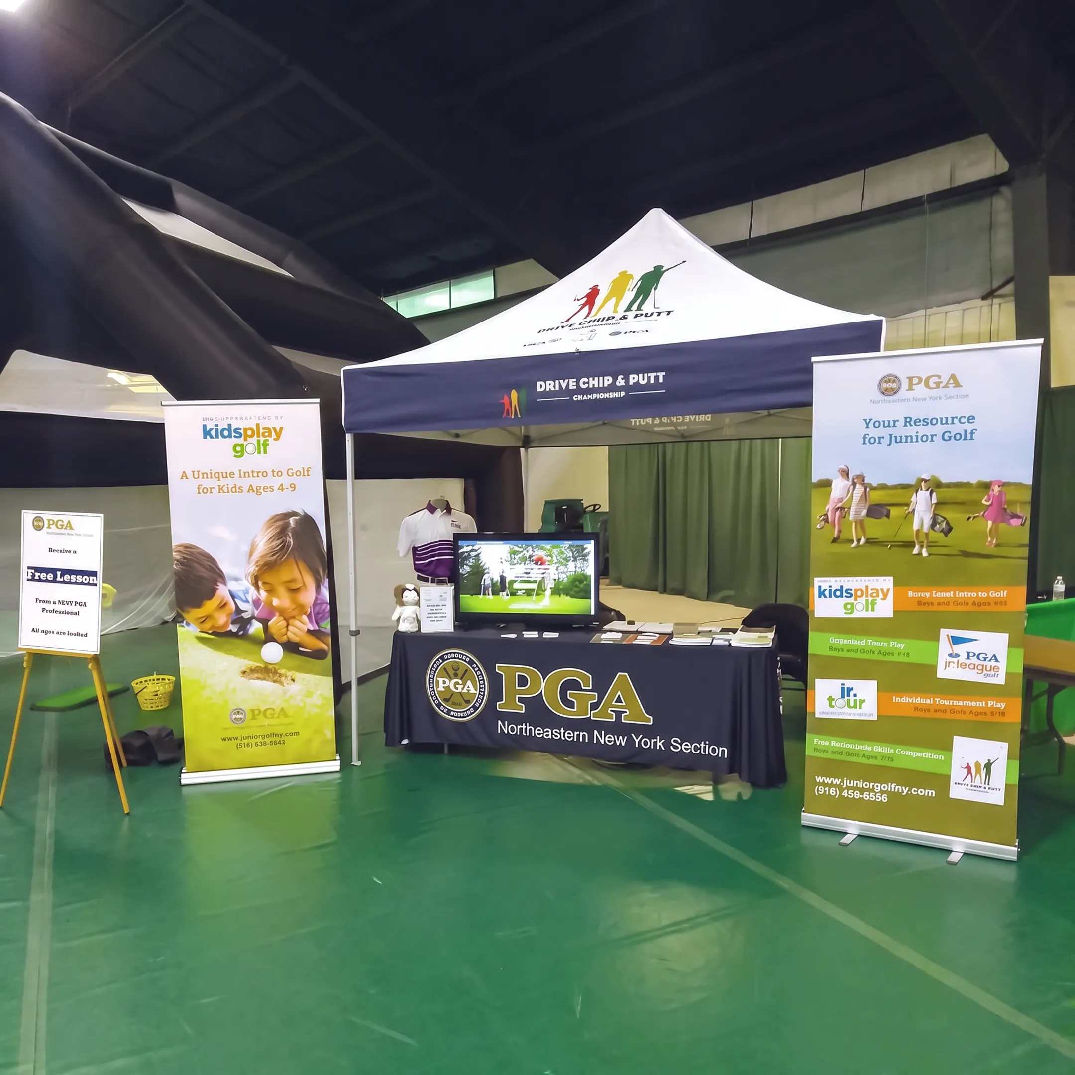 Trade show booth with branded banners, display graphics, and printed marketing materials