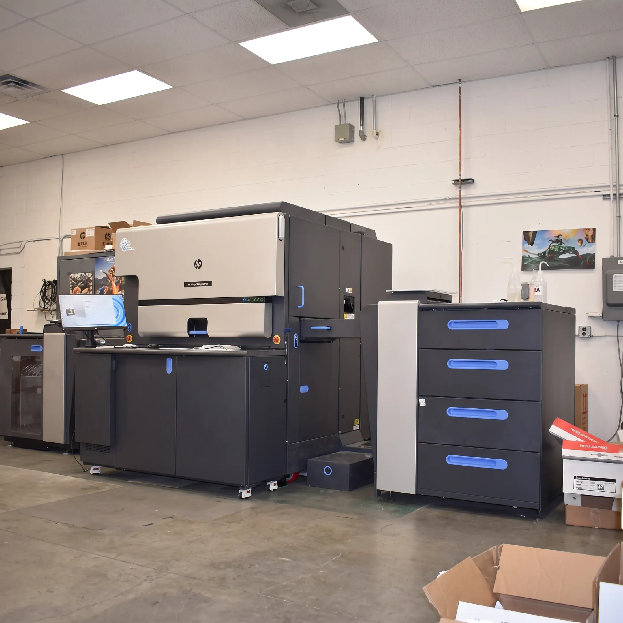 Specialty printing team producing colorful commercial print materials and large-format graphics