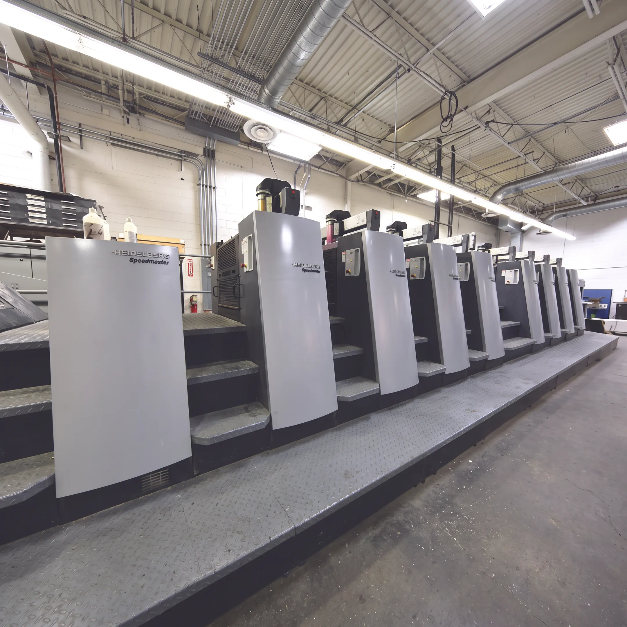 Corporate graphics and printed materials arranged in a professional production setting