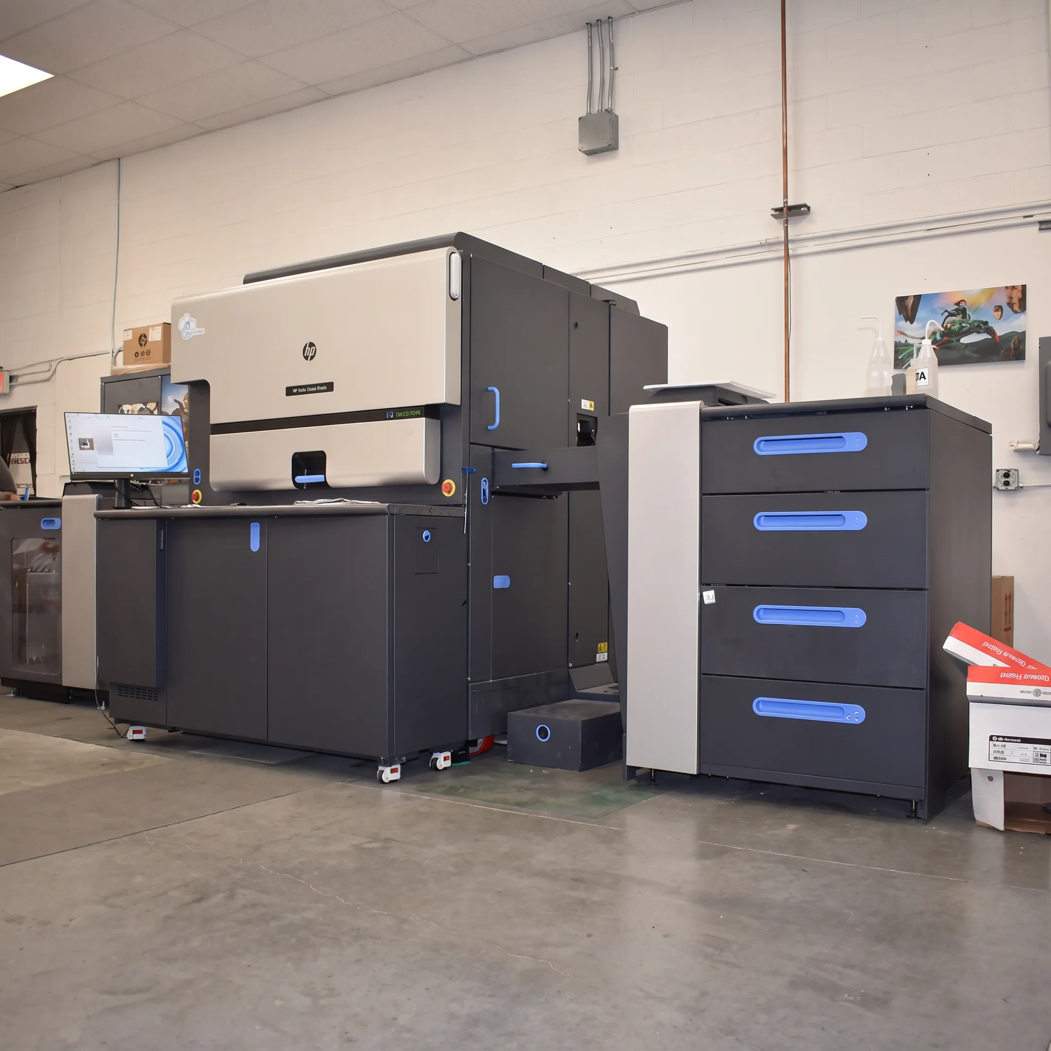 Digital printing team producing colorful business materials on advanced press equipment