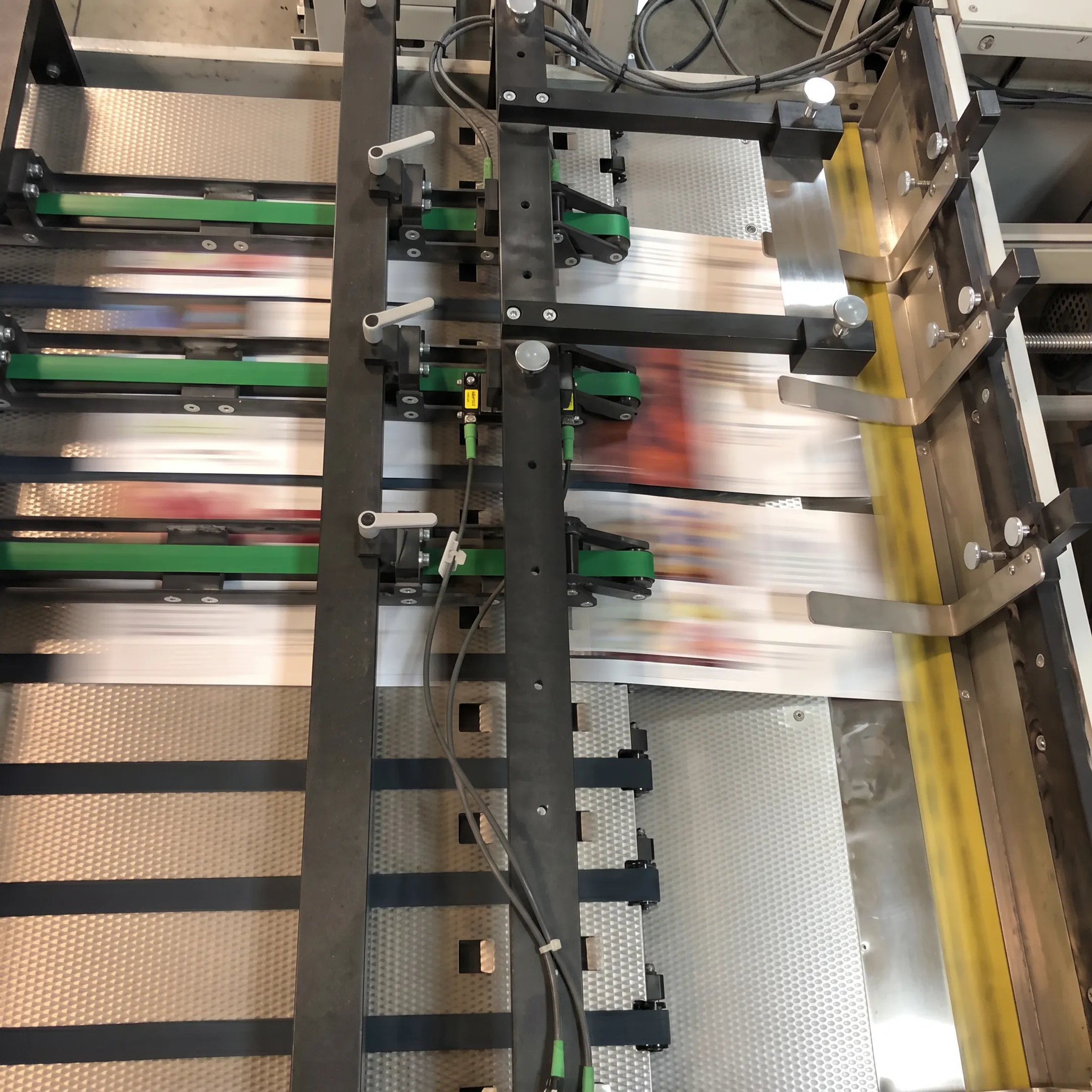 Personalized direct mail pieces moving through an integrated commercial mailing operation
