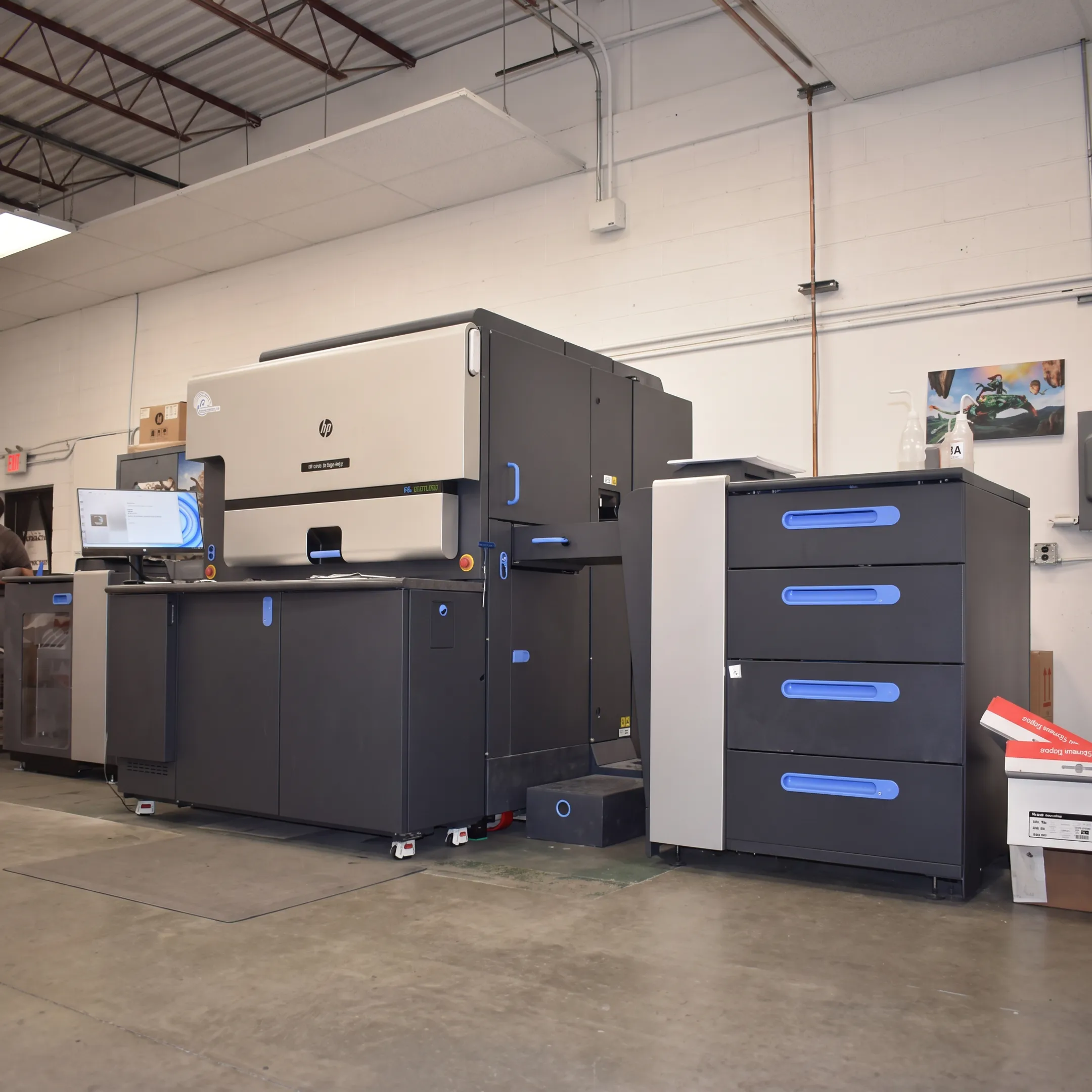 Digital printing team producing branded materials in a commercial print facility