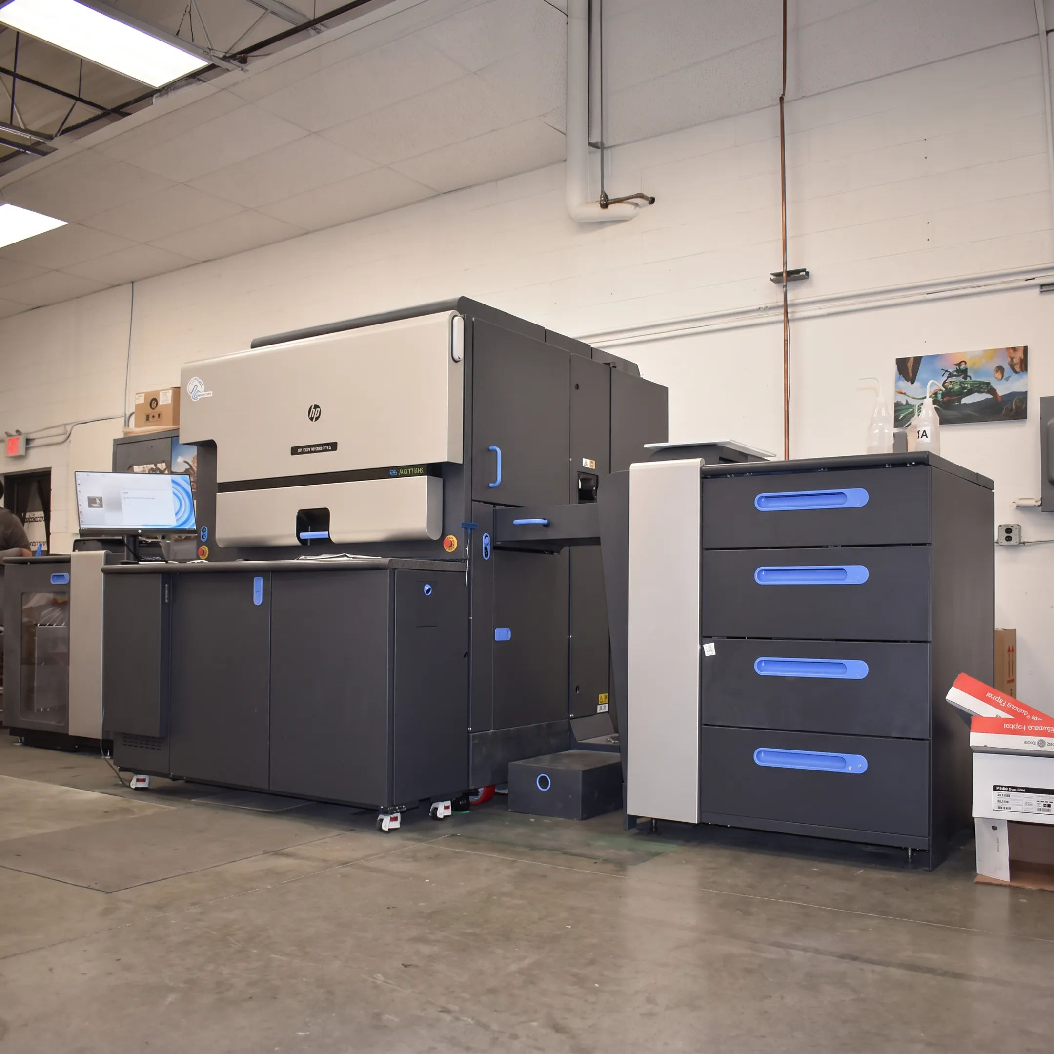 Team coordinating web-to-print ordering with commercial print production
