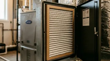 Premium 5-inch pleated MERV 16 furnace filter in residential HVAC cabinet