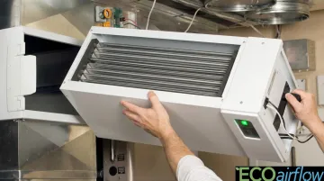 Whole-home electronic air cleaner unit installed inside residential HVAC duct system