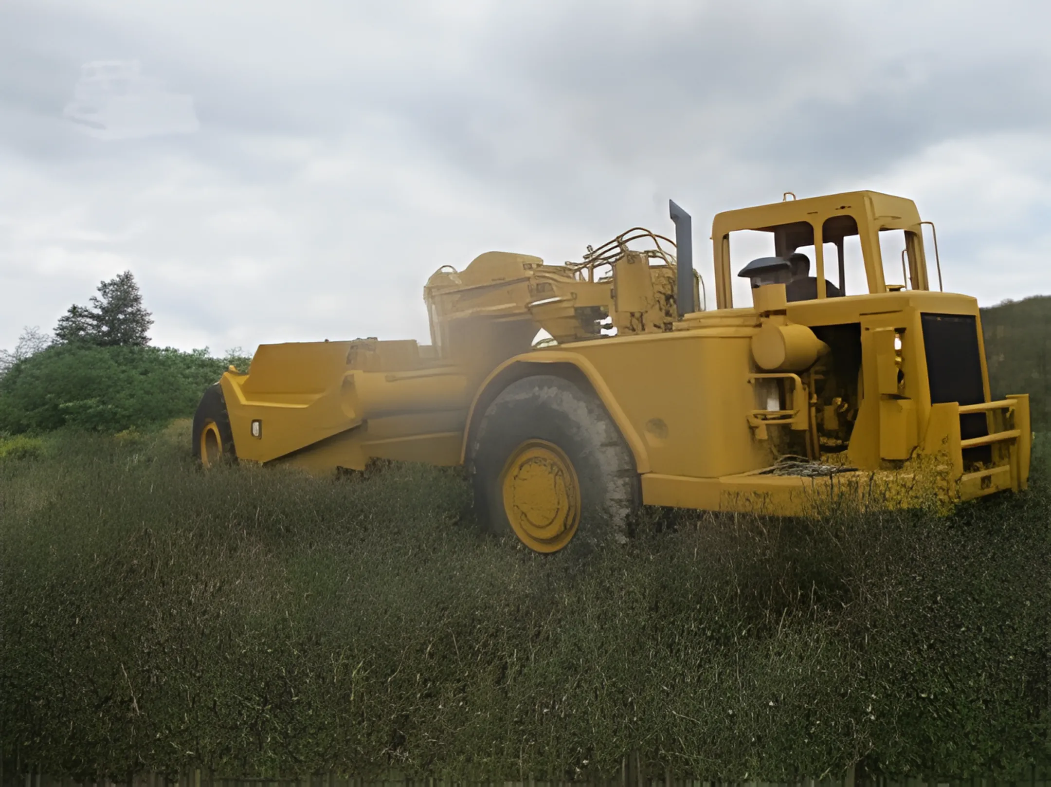 Earthmoving contractor using a tractor scraper