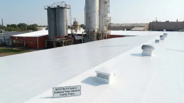 ASTEC Re-Ply roof coating system applied to commercial flat roof in Southeast Texas