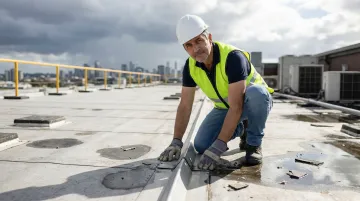 Professional roofing inspector examining commercial flat roof after hail storm damage