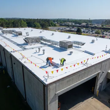 Industrial flat roof replacement in progress