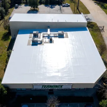 White TPO membrane roof on a commercial building