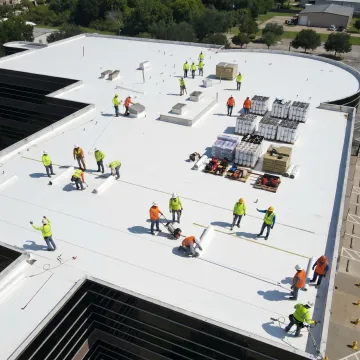 Commercial roofing installation process on a new building