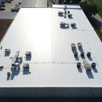 White TPO membrane roof on commercial building