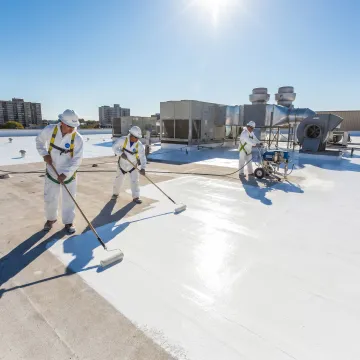 Industrial roof coating application process on commercial building