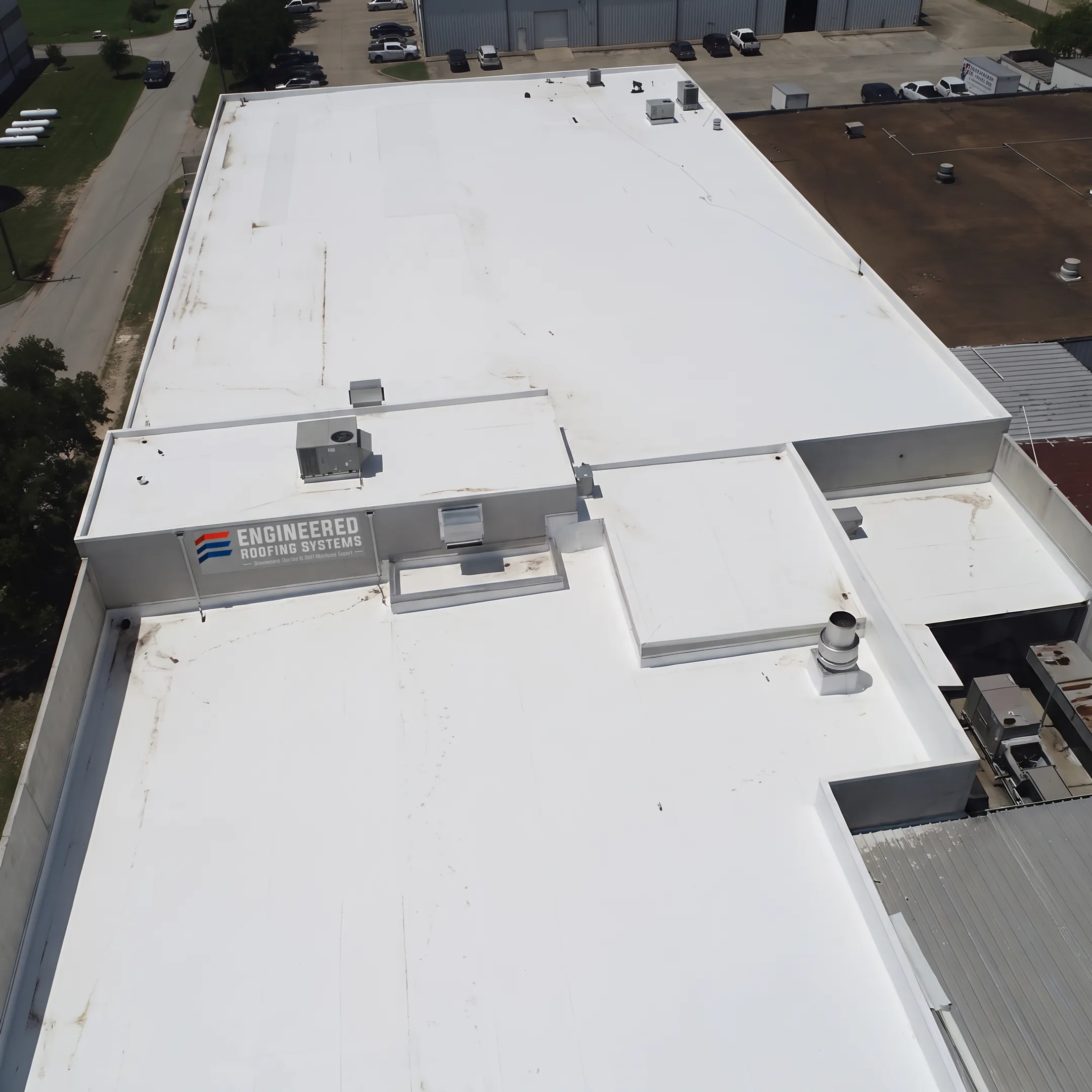 White coating protecting a commercial TPO roof