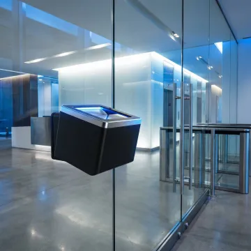 Professional touchless biometric palm vein scanner mounted on modern facility entrance