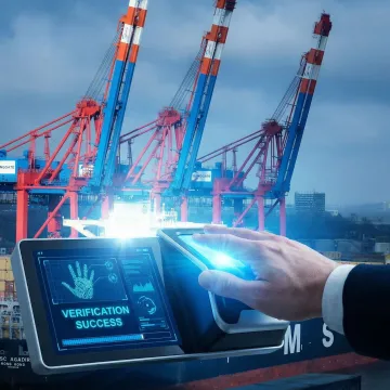 Close-up of hand hovering over contactless palm vein biometric scanner