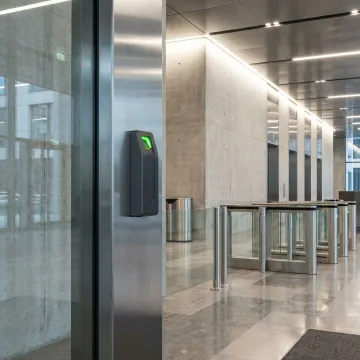 Advanced biometric palm scanner mounted on secure facility entrance