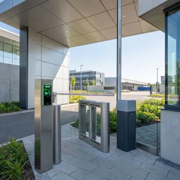 Advanced biometric gate access control system with palm scanner at secure facility entrance