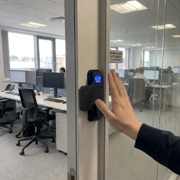Biometric access control system installed at a commercial doorway