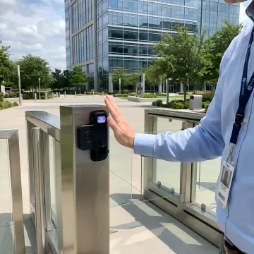 Modern office building entrance gate with advanced biometric security system installation