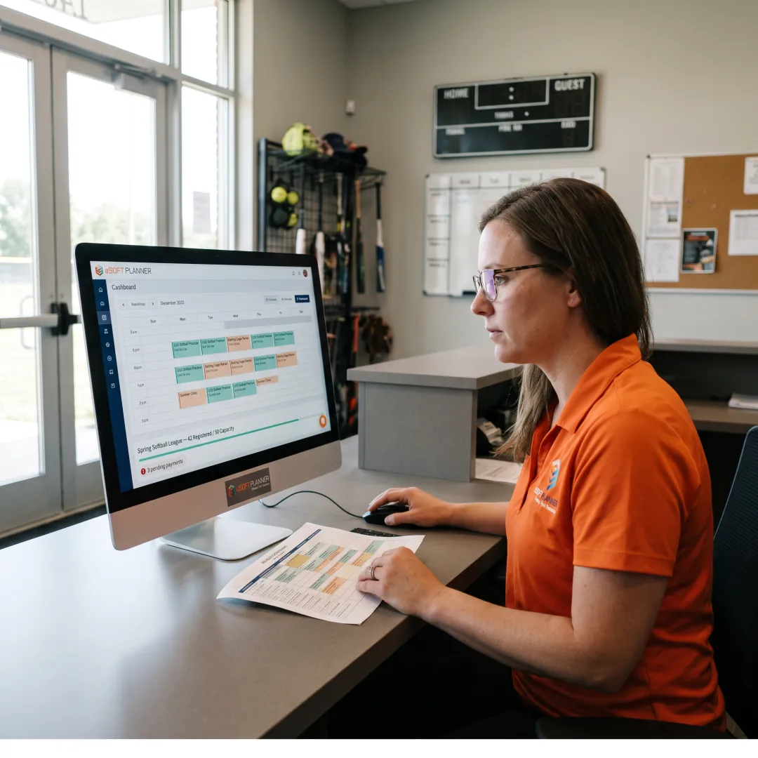 Staff member managing softball registrations