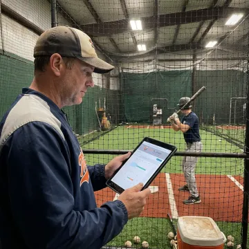 Baseball coach scheduling a private lesson