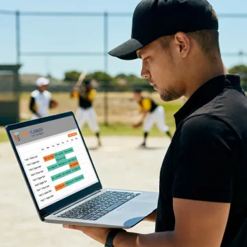 Baseball facility manager reviewing field reservations