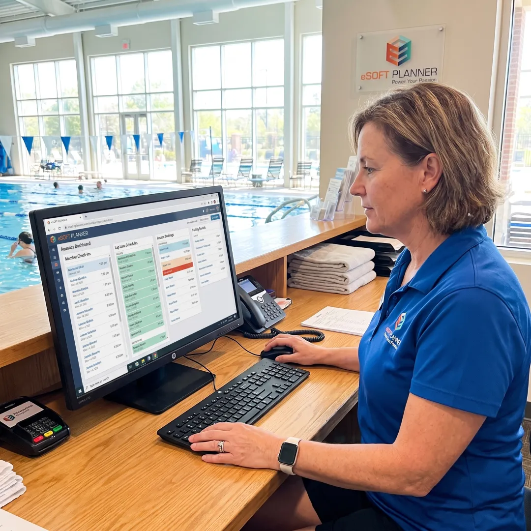 Staff member managing swim club bookings