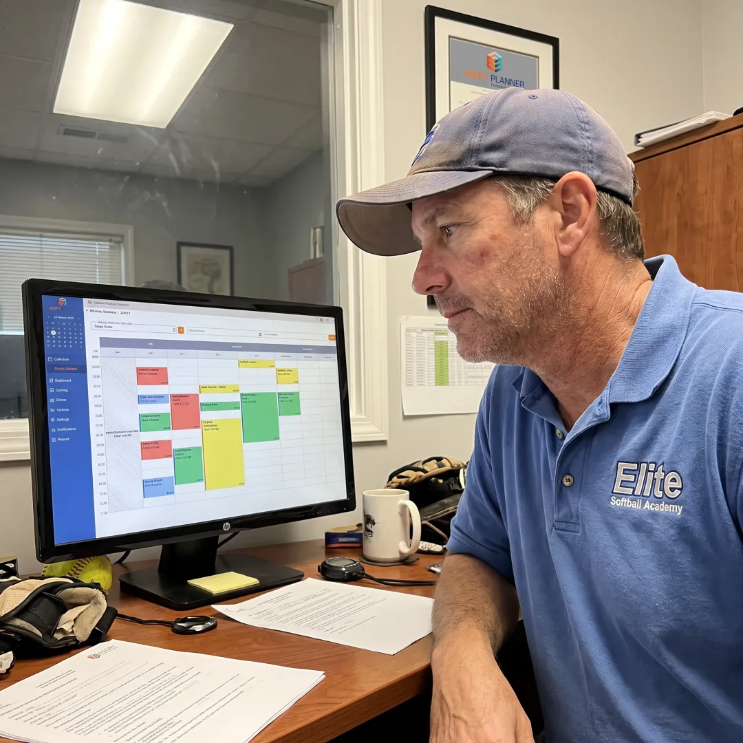 Coach reviewing softball program bookings