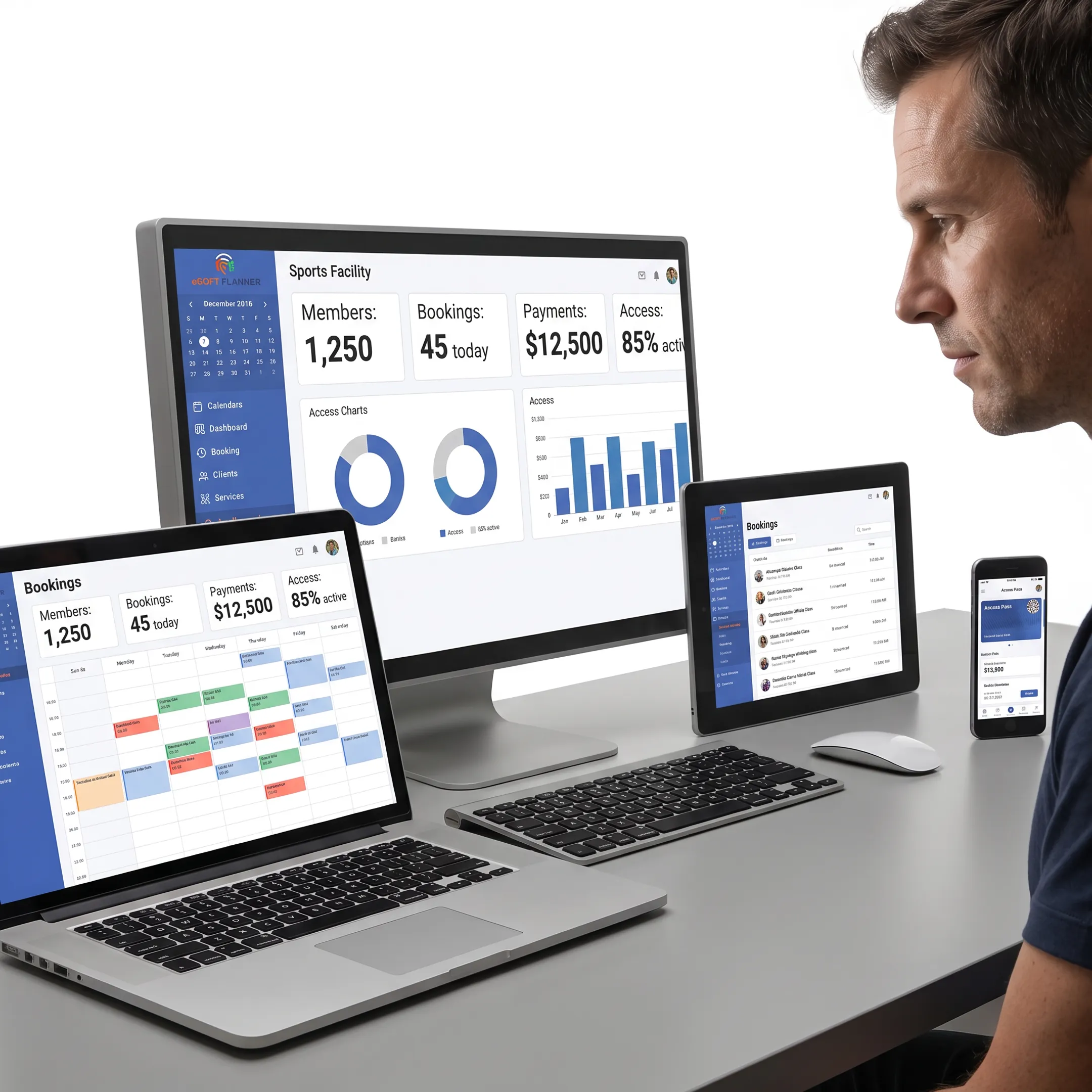 Sports facility staff reviewing member tracking software on a computer