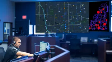 Emergency ambulance dispatch operations center with digital mapping and resource tracking screens