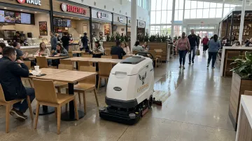 Gausium Scrubber 75 autonomous robot cleaning busy shopping mall food court