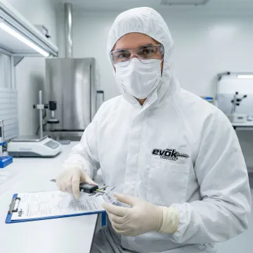 Medical device engineer reviewing injection molded healthcare component specifications