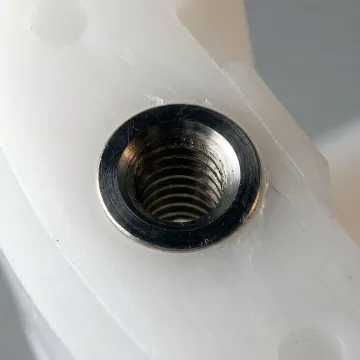 Close-up of precision micro injection molded components showing intricate detail